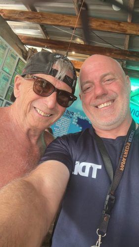 A couple of Trident Warriors taking a picture while in between scuba dives during the veterans trip to the Philippines in 2025