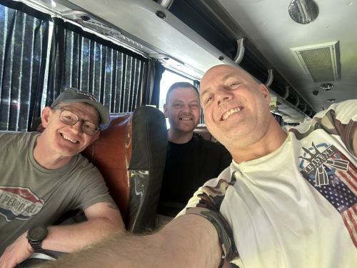 Trident Warrior divers having a few laughs while on the bus to the next scuba stop 