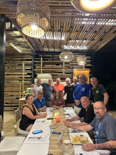 The Trident Warrior divers enjoying some fine dining after a full day of scuba diving in the Philippines for the 2025 trip