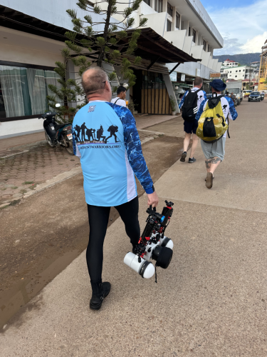 A Trident Warrior scuba diver making his way with some equipment that will be used on the next dive