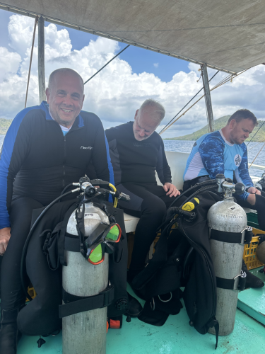 A few scuba divers with Trident Warriors getting ready for the upcoming dive during the 2025 trip to the Philippines