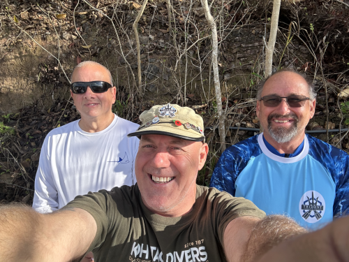 Some Trident Warriors and the founder grabbing a picture during a break from a little scuba diving
