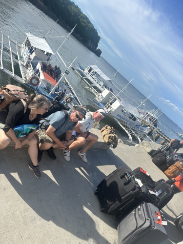 A group of Trident Warrior divers patiently waiting for their next chance to go and make some bubbles while on the 2025 scuba trip. 