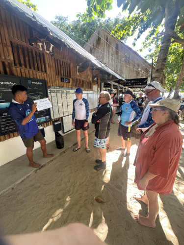 Trident Warriors getting their latest scuba diving briefing while they are on the Philippines 2025 dive trip with Evolution Diving Resort, Malapascua.
