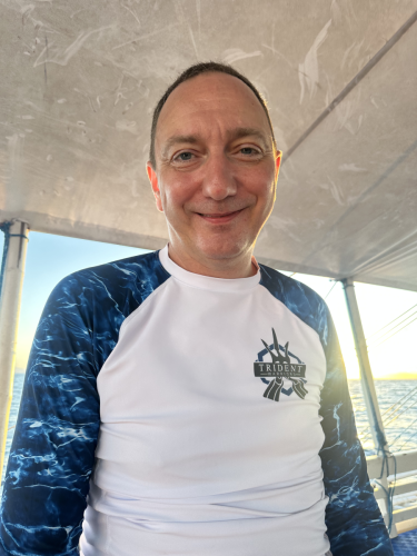 A Trident Warriors scuba diver taking the opportunity to smile for the camera